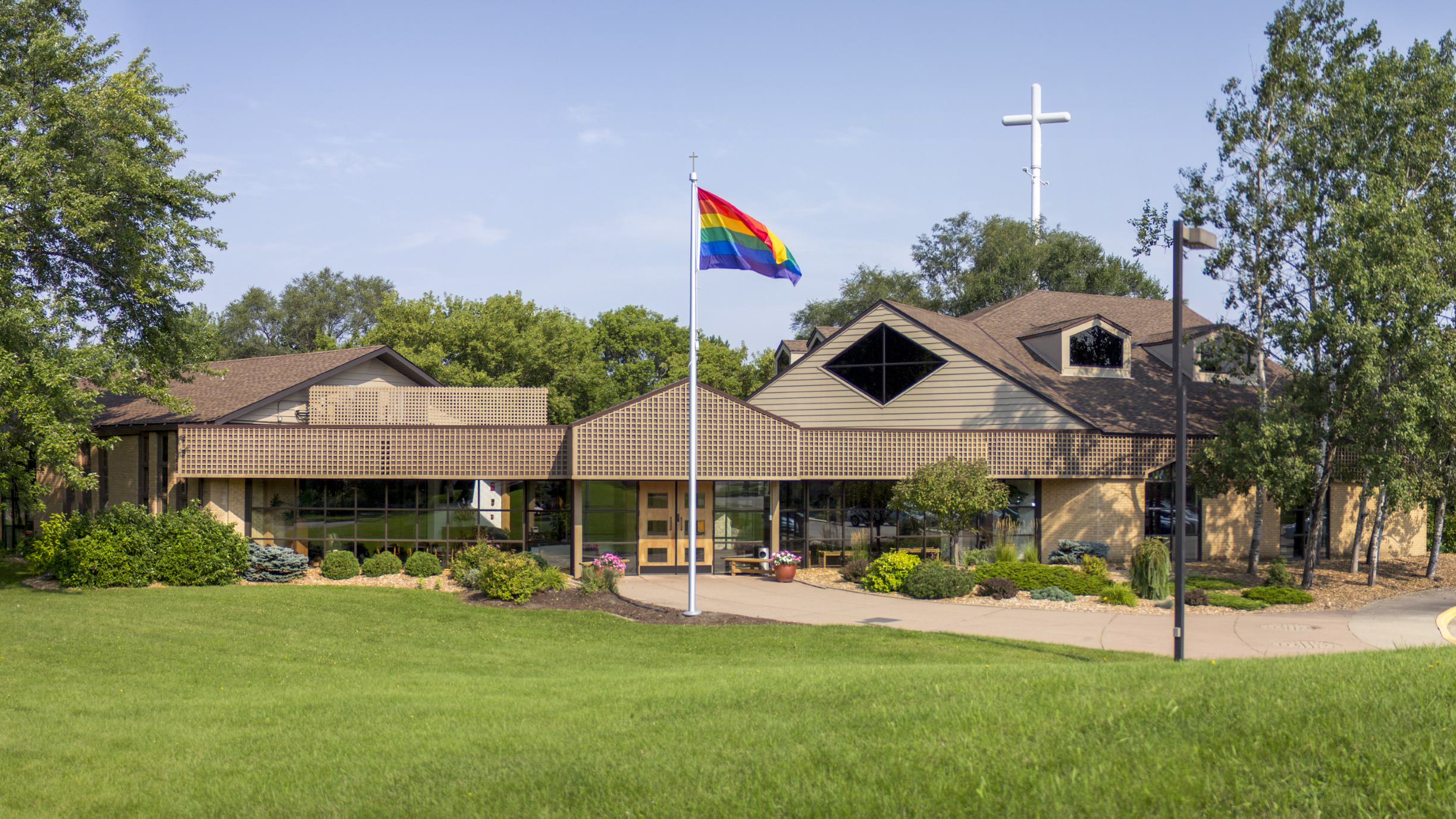Church building with rainbow flag